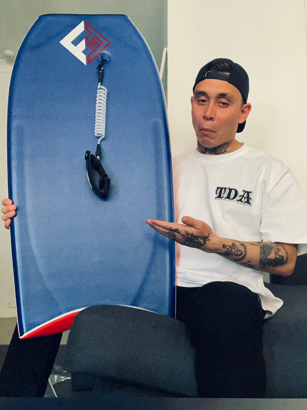 White Till Death Apparel T-shirt worn with a bodyboard