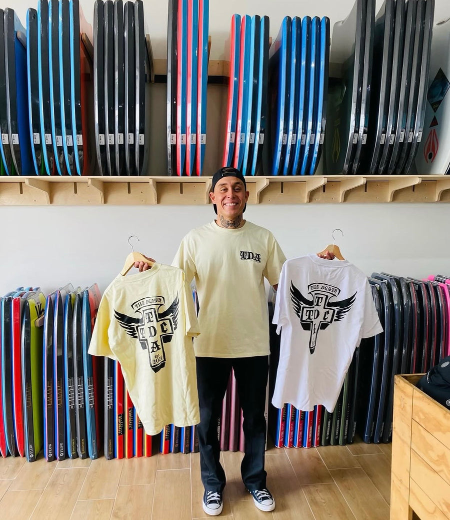 White and butter Till Death Apparel shirts in a surf shop