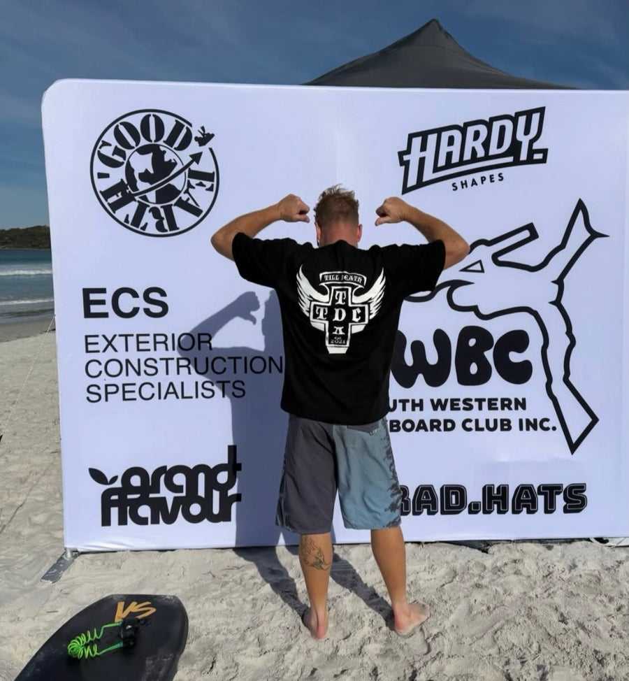 Black Till Death Apparel T-shirt worn at a board-riding event